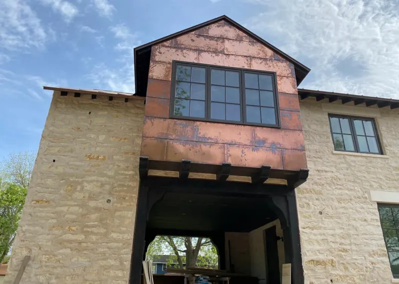 Copper metal panel facade on a stone building for Metal Roof Coating in Southwest Ranches
