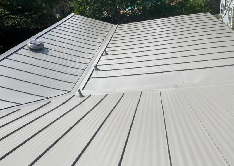 Solar attic fan installed on a metal roof for Roof Ventilation in Southwest Ranches